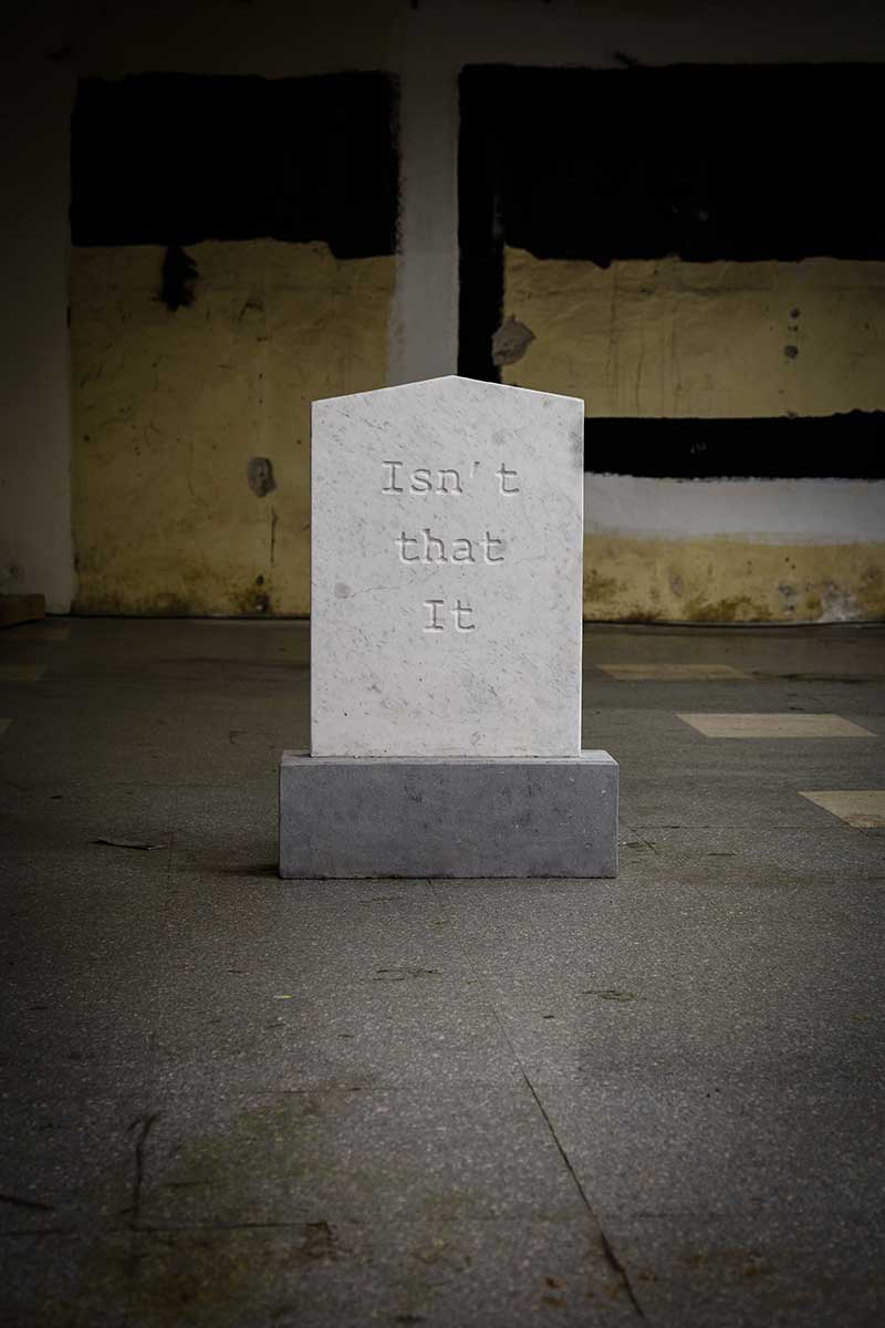 mike ahern headstone with 'Isn't that it' carving