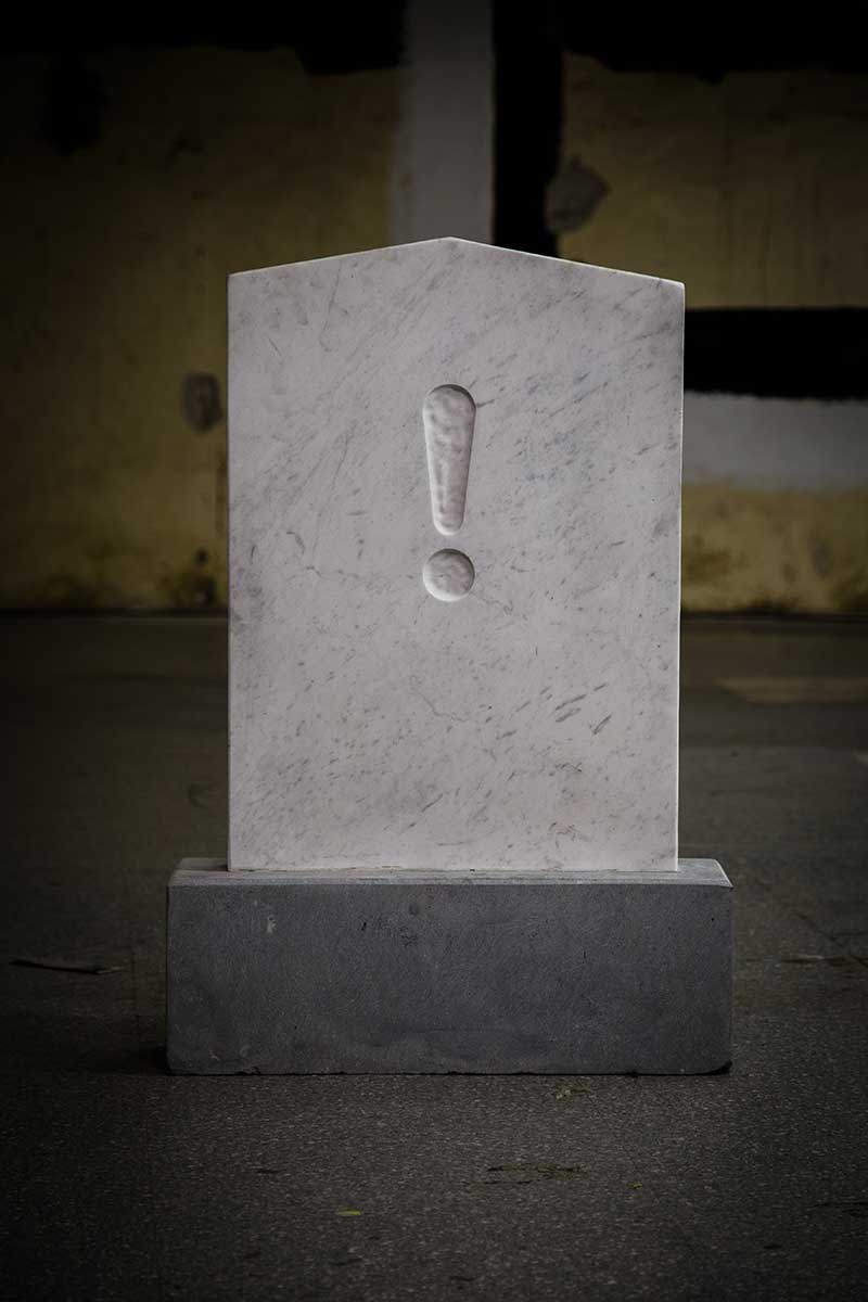 mike ahern headstone with '!' carving